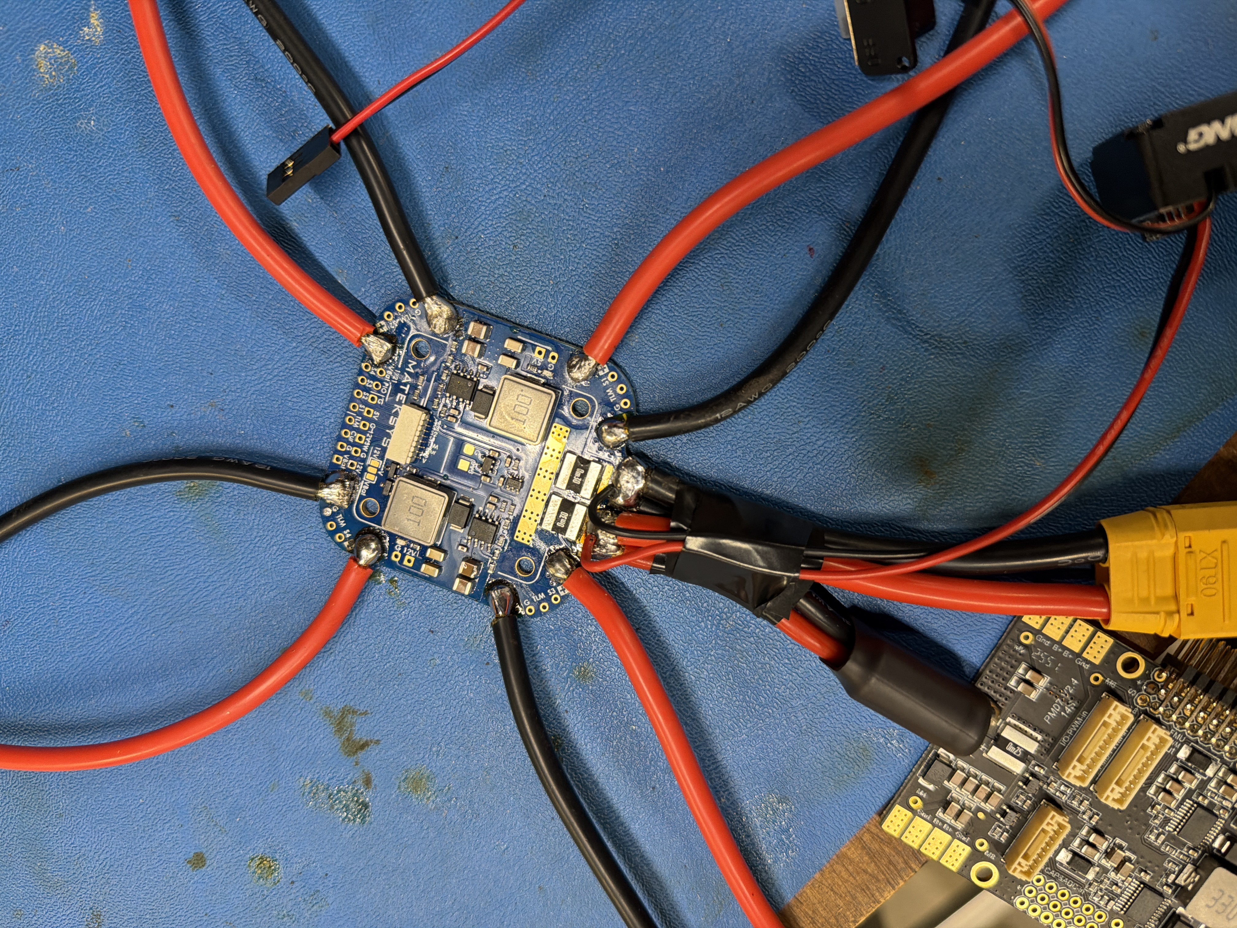 PDB with ESC wires soldered, close-up