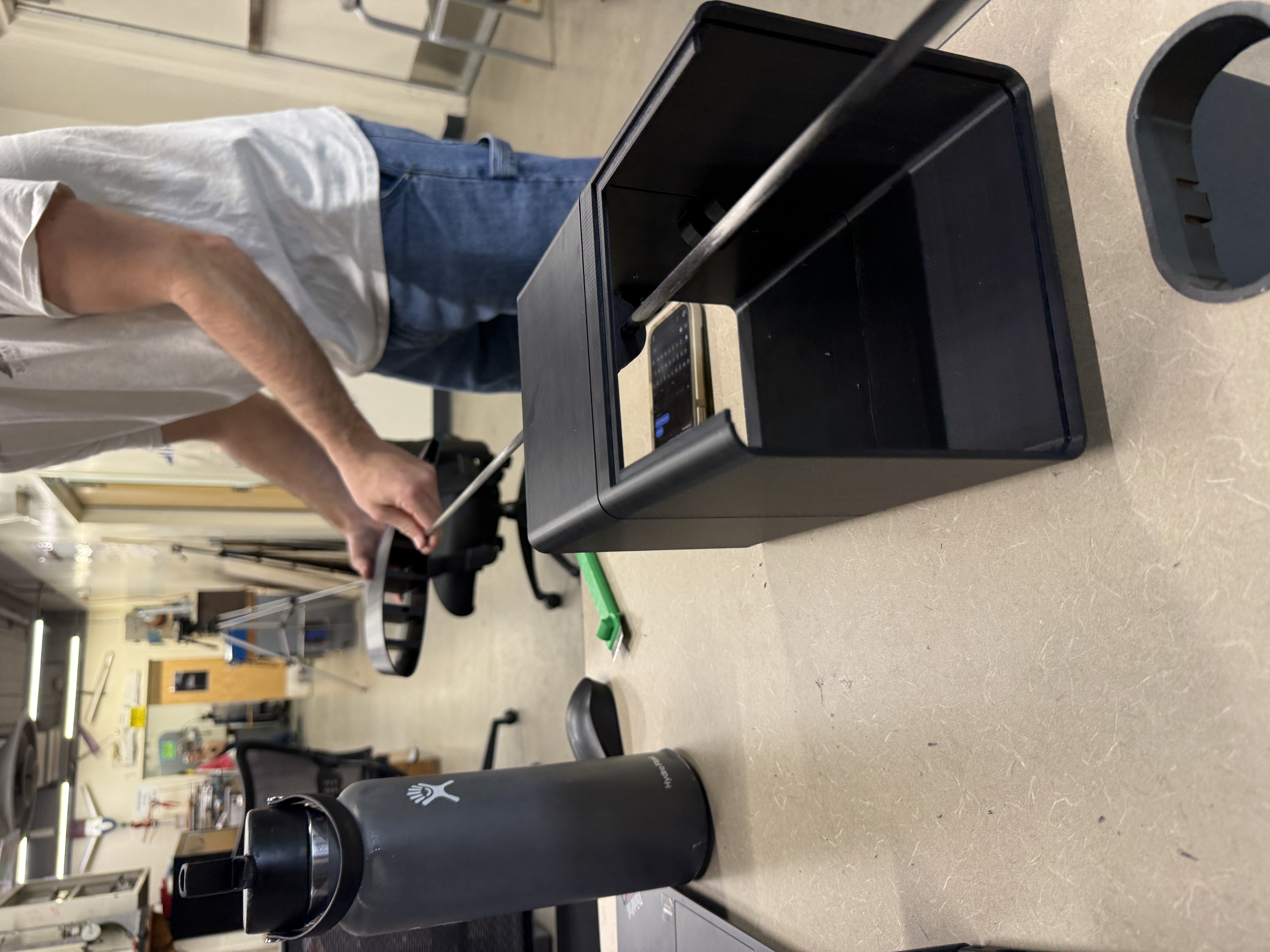 Carbon fiber spar being fitted into printed fuselage section